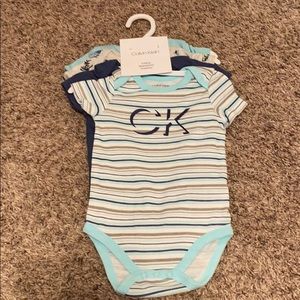 6-9 Months Calvin Klein Onesies 4 Pack NWT